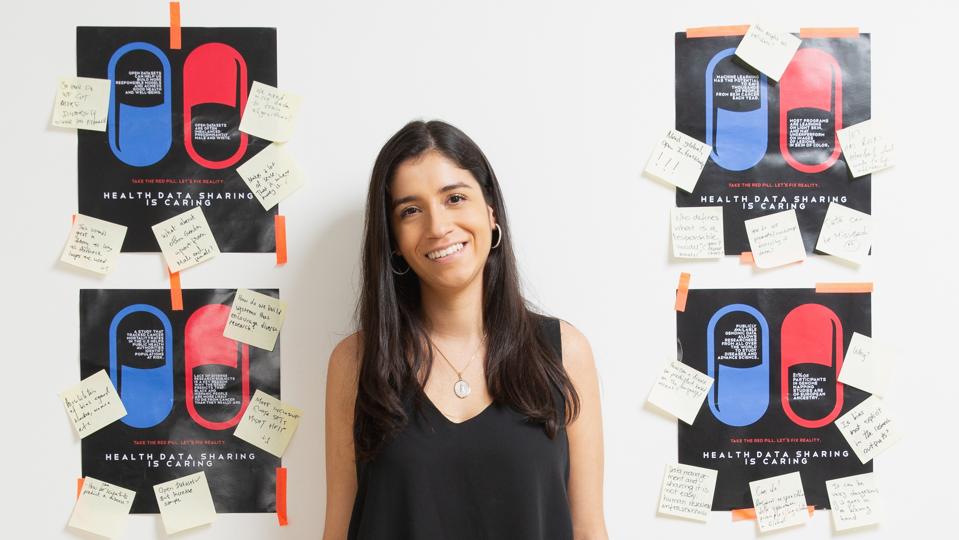 Natalia Norori, with posters created for the Health Data Sharing is Caring Project