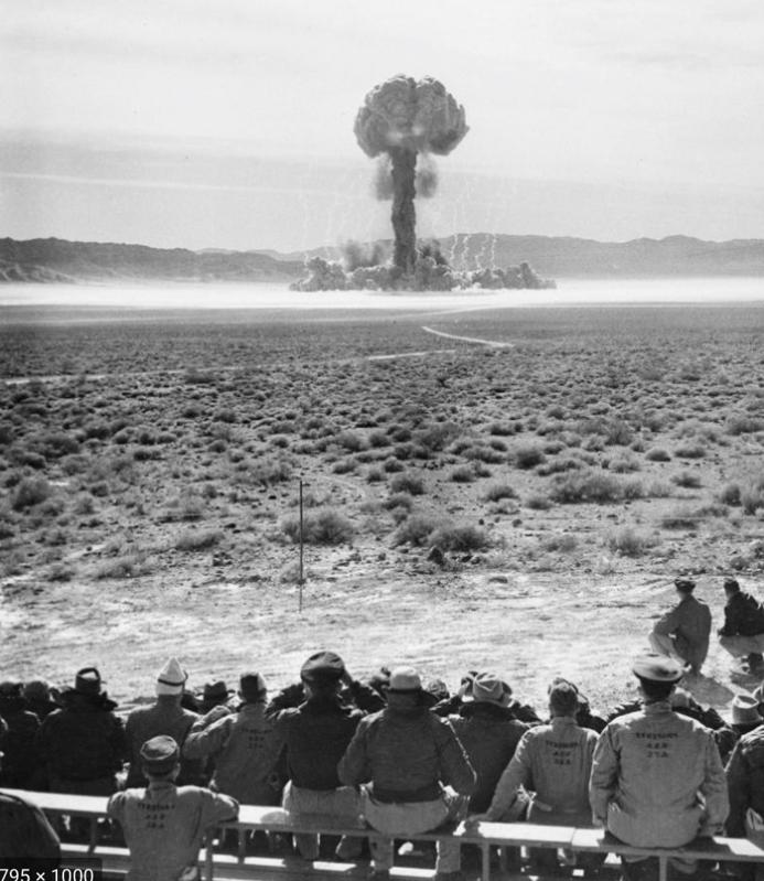 Nevada Test Site atomic bomb test with troops looking on