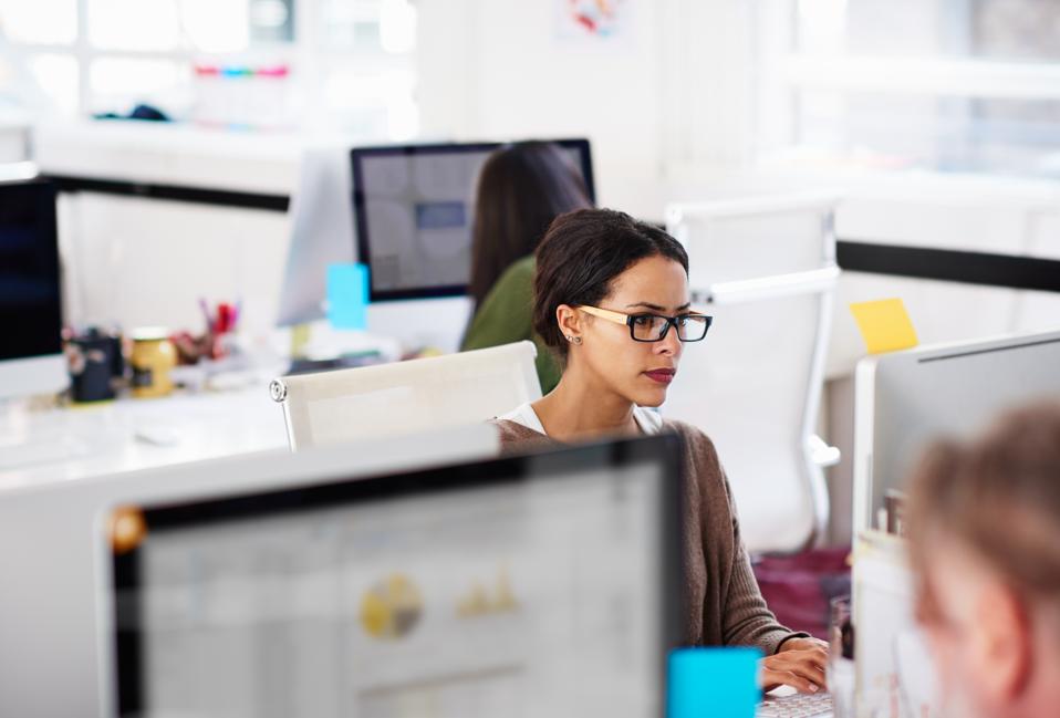 Business woman at work station in start-up office