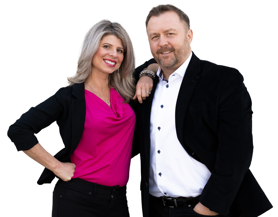 Wife and husband standing next to each other with arms around one another
