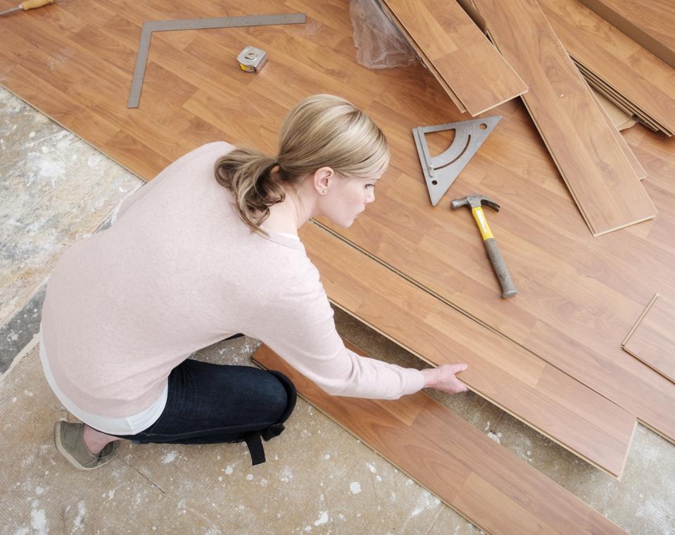 Woman Installing Laminate Flooring