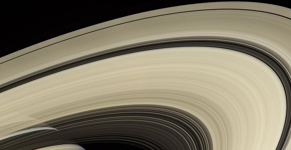 Saturn's rings, with the planet visible through the rings and behind them.