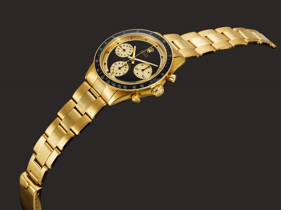 The Rolex Cosmograph Daytona JPS reference 6264 in 18k yellow gold