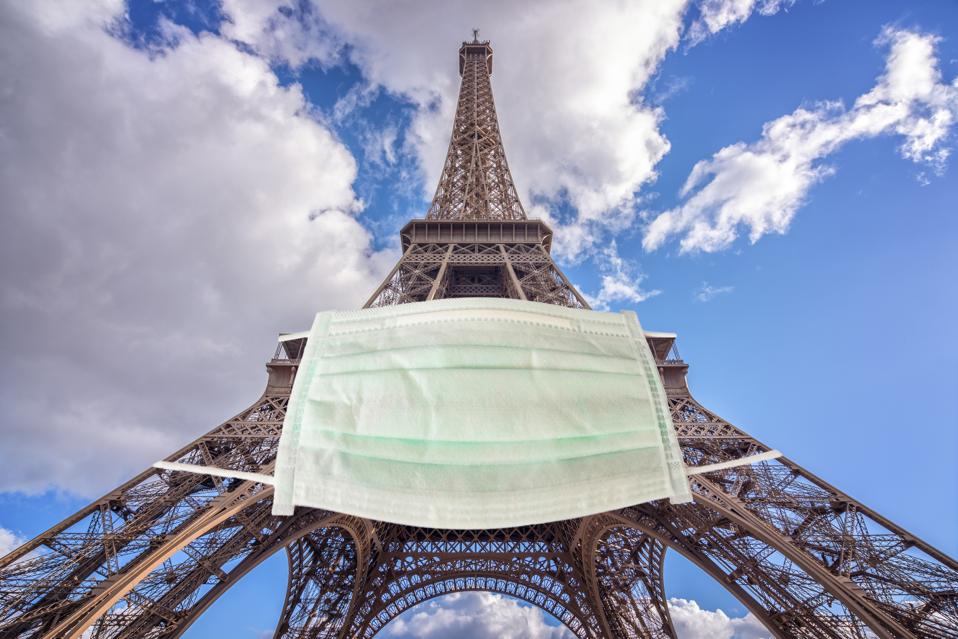 Eiffel tower wearing a surgical mask.