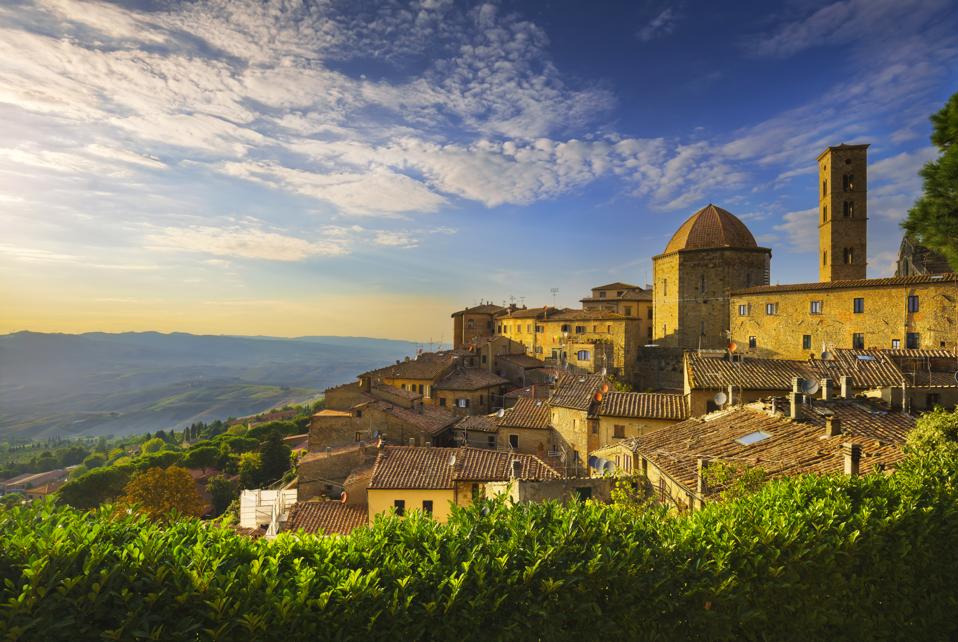 Tuscany, Volterra town skyline, church and panorama view during sunset
