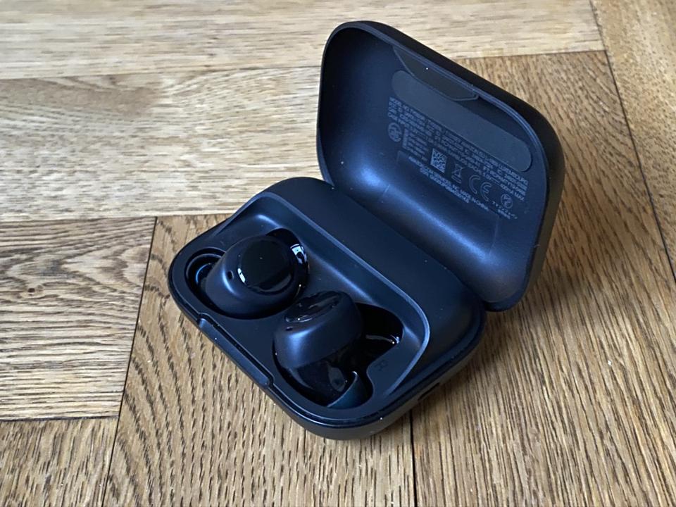 Amazon Echo Buds in their charging case.