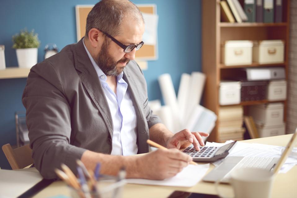 Mature Adult man working in the office