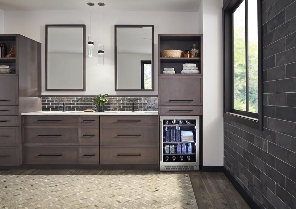 Beverage cooler in bathroom.