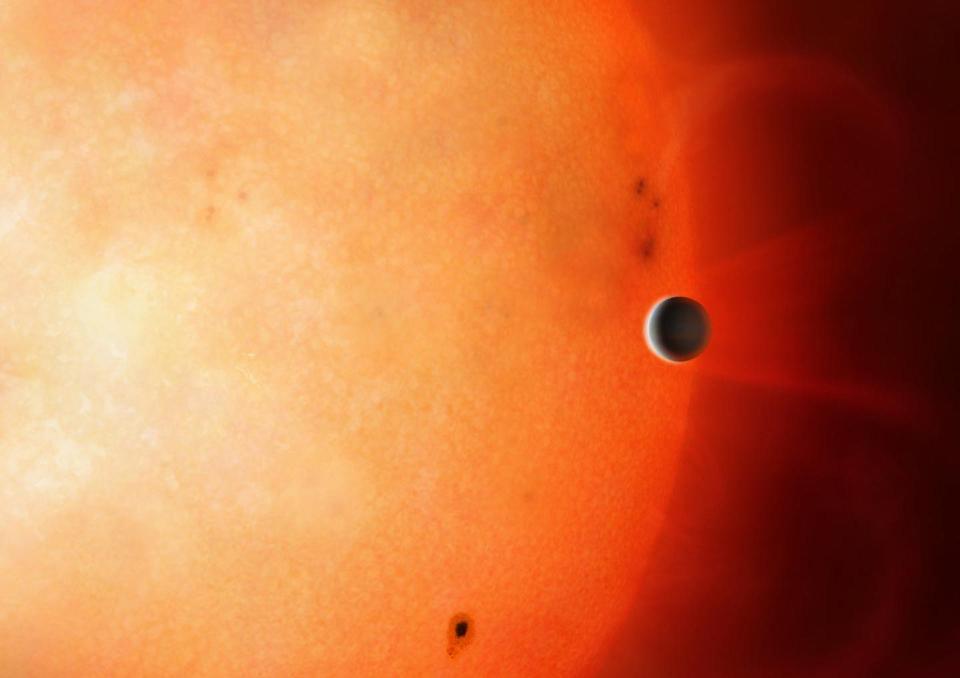 A gas giant planet in close orbit to a star has its outer layers stripped away.