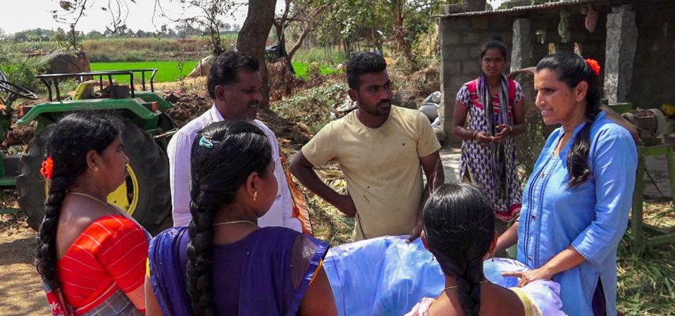 Thanammal Ravichandran (far right) and women from the Mulkanoor Women's Cooperative Dairy