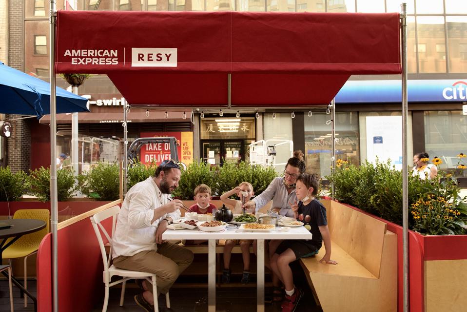 family in outdoor dining