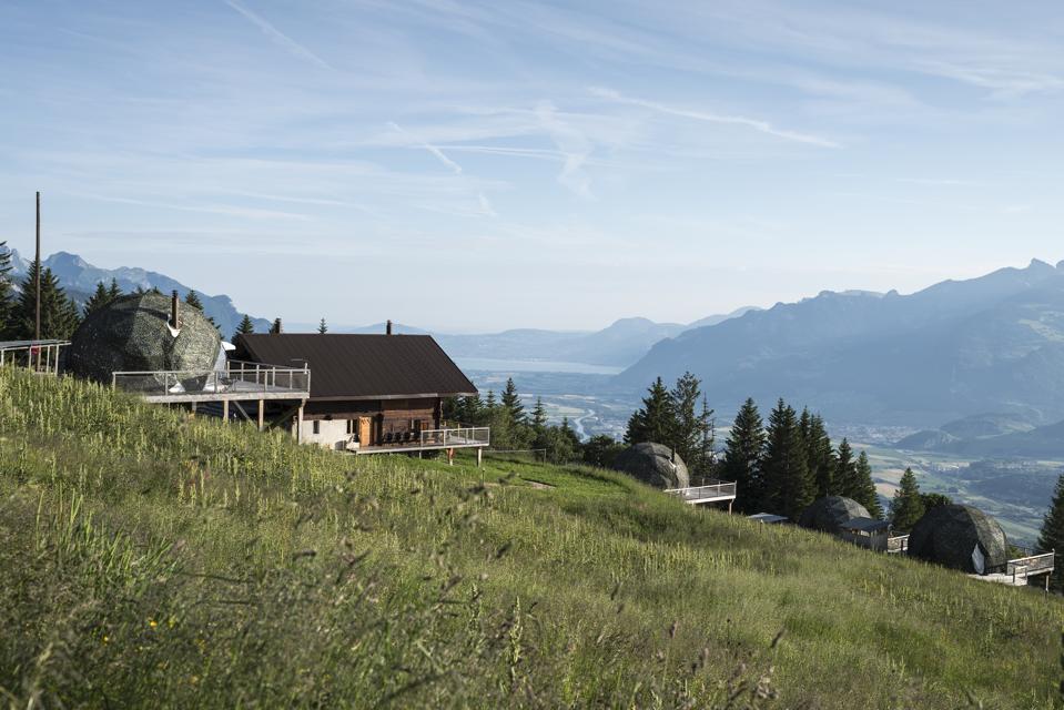 The Whitepods on the slope in the high Alps, with in the background Lake Leman and Montreux