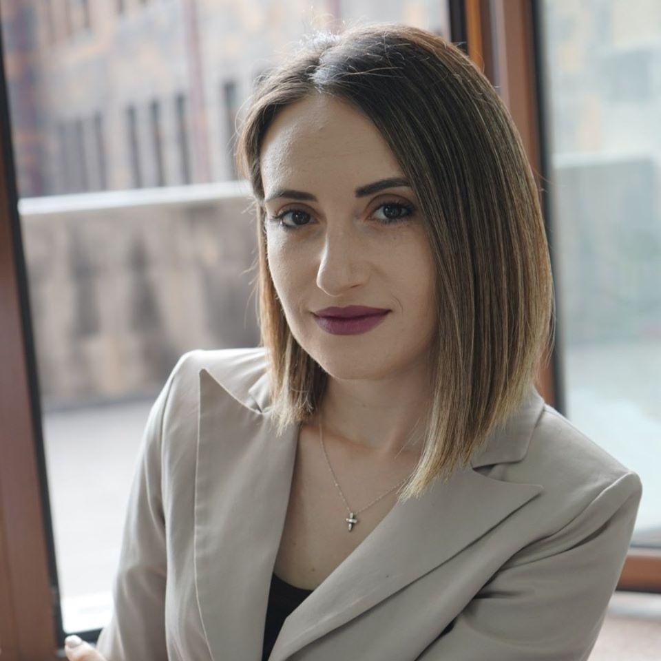 Gayane Ghandilyan Arakelyan - sitting by a window.