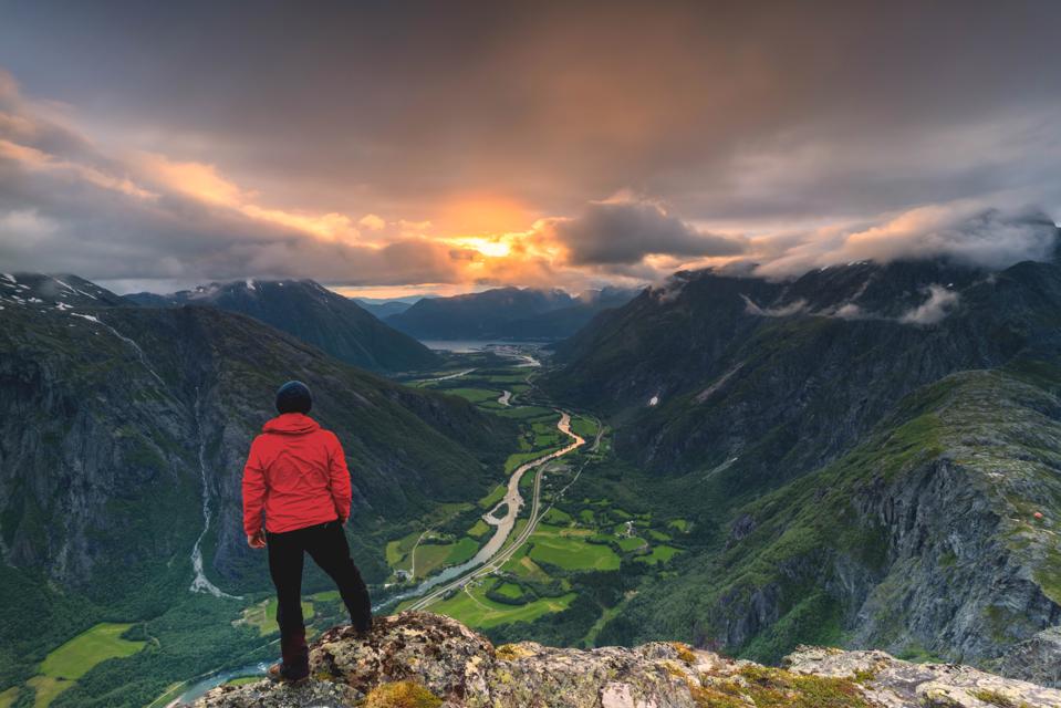 Hiker on Romsdalseggen ridge in Åndalsnes, Norway.