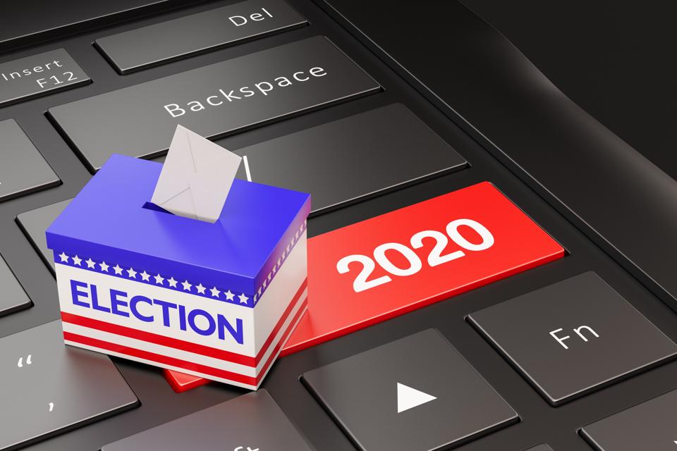 Election ballot box on top of keyboard with a 2020 enter key in red