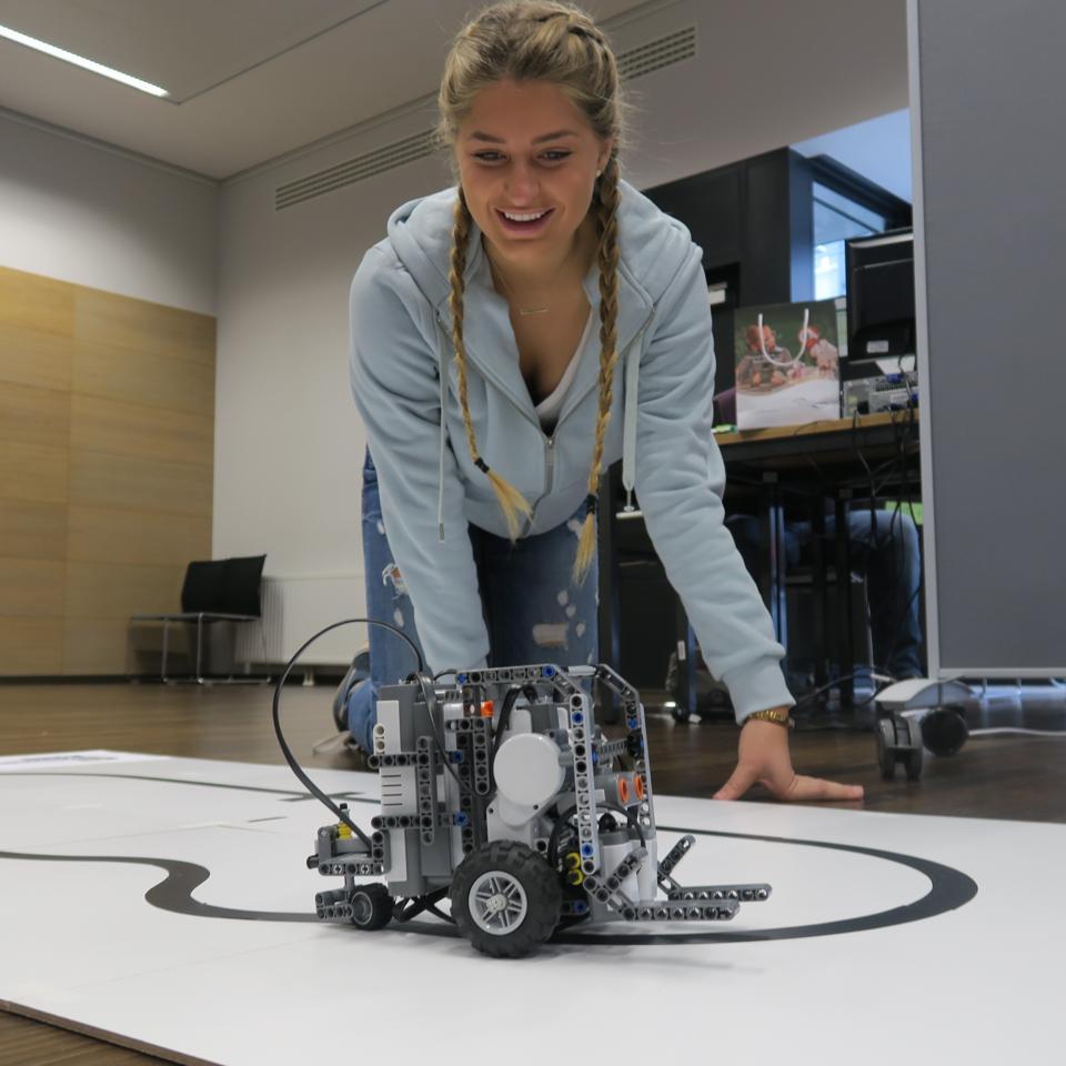 A girl working on a robot project for Gap Year.