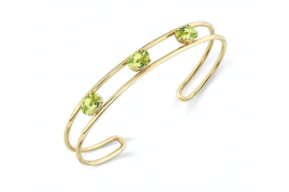 Celebrate Peridot, An August Birthstone, With These Beautiful Pieces Of Peridot Jewelry 6 Sarah Hendler Tres Stone Double Wire Cuff in 18K yellow gold with peridot, $2,850, sarahhendler.com