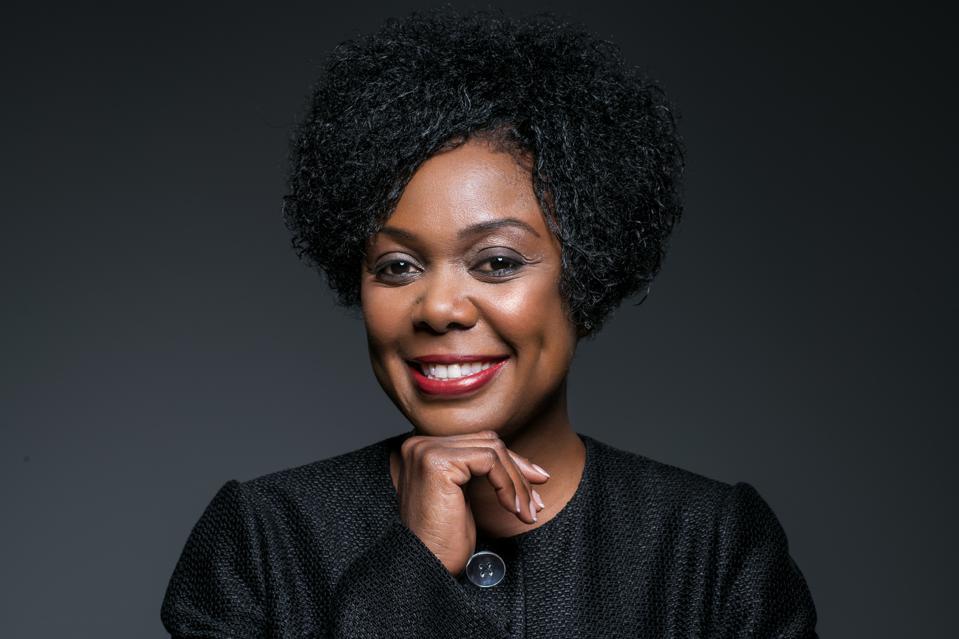 Yolanda Lee Conyers, Chief Diversity Officer and President, Lenovo Foundation, Lenovo smiling with her right hand under her chin