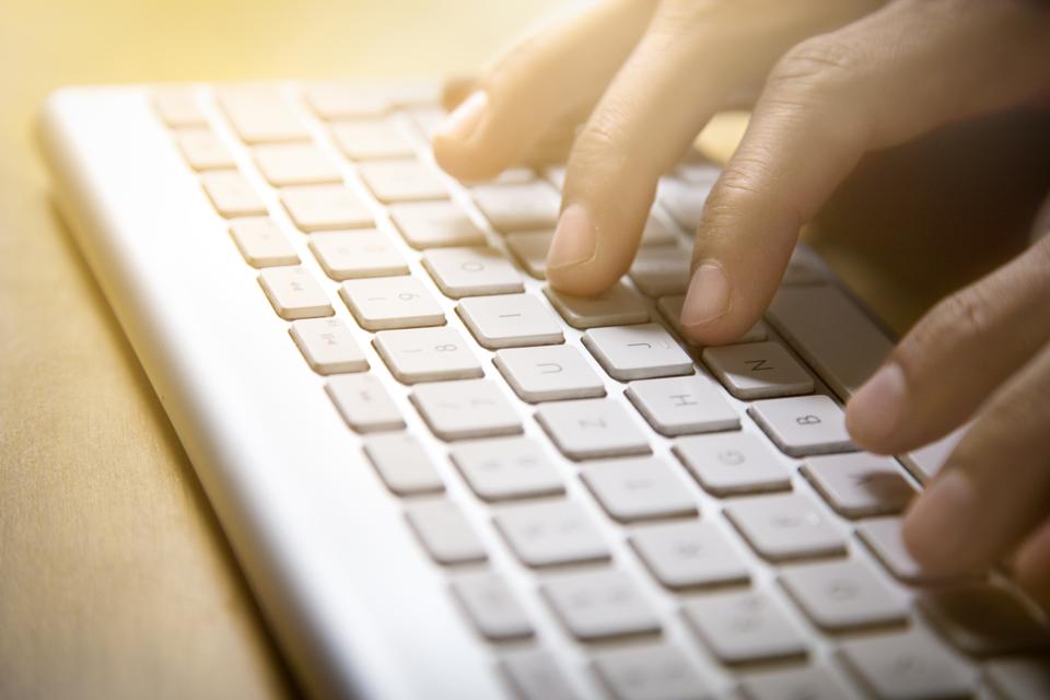 Close-Up of hands on computer keyboard
