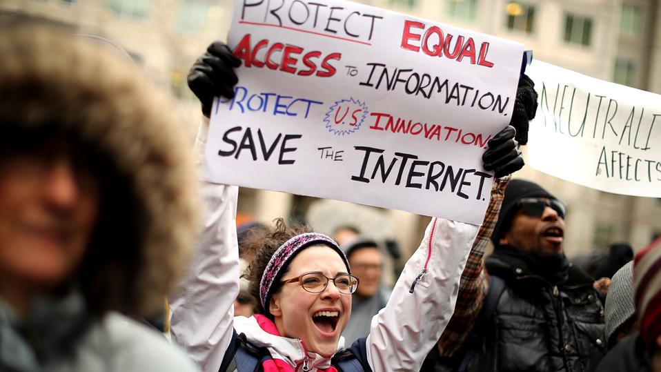 Protesters rally at FCC against repeal of net neutrality rules