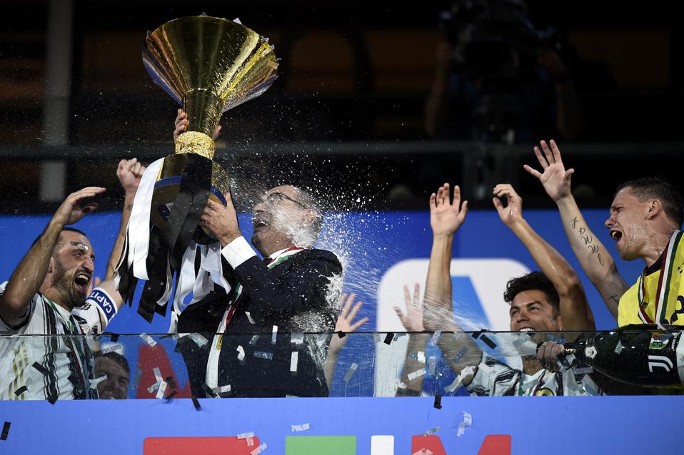 Maurizio Sarri (C), head coach of Juventus FC, celebrates...