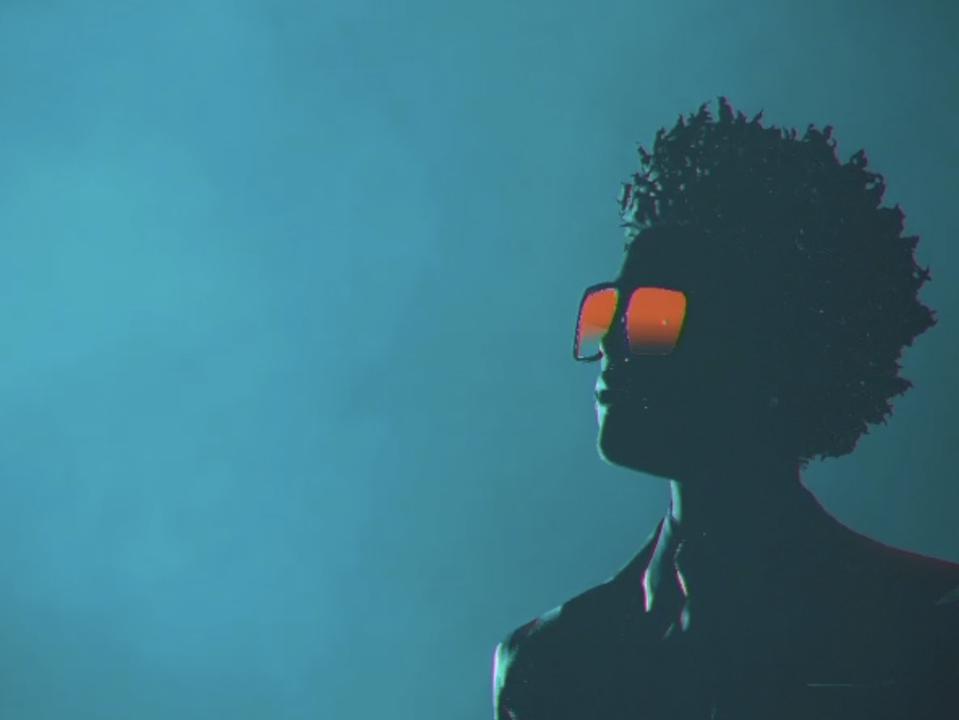 the singer's virtual avatar stares into space.