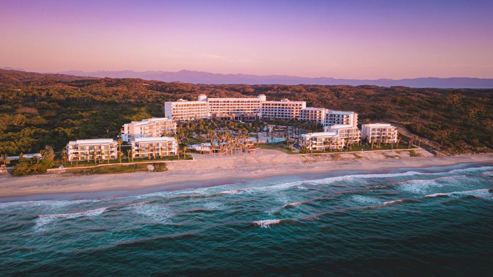 A sprawling hotel near the ocean.