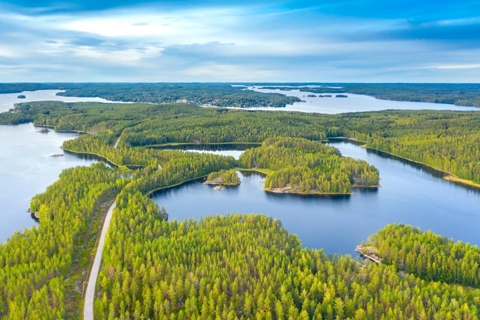An aerial view of the road crossing Saimaa lake in Puumala, Finland.
