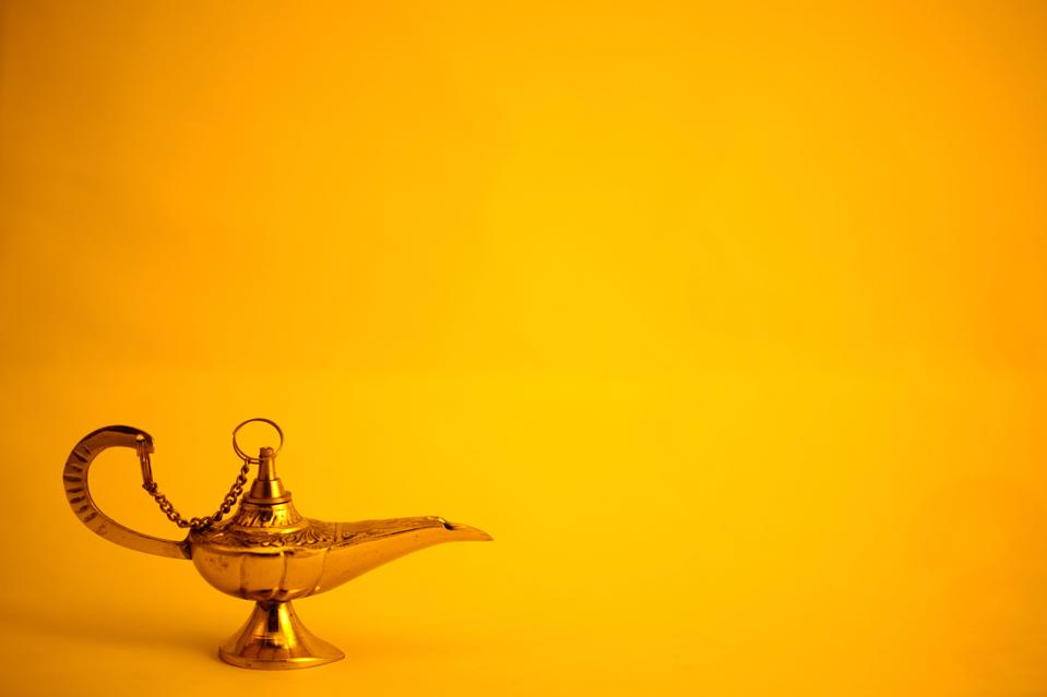 A genie's lamp on yellow background. The world could use 3 wishes these days, ammirite?