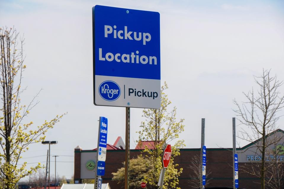 A ″pickup″ sign is displayed at a Kroger grocery store as the coronavirus pandemic prompts some consumers to avoid in-person shopping, on April 28, 2020 in Canton Township, Michigan.