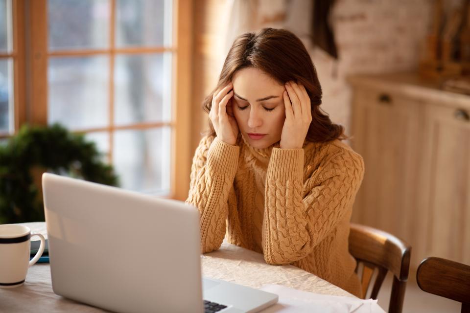 Woman with long hair suffering from headache
