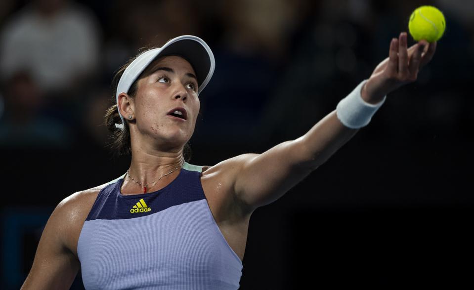 MELBOURNE, AUSTRALIA - FEBRUARY 01: Garbine Muguruza of Spain serves in her women's singles final match against Sofia Kenin of the United States on day thirteen of the 2020 Australian Open at Melbourne Park on February 01, 2020 in Melbourne, Australia. (Photo by TPN/Getty Images)