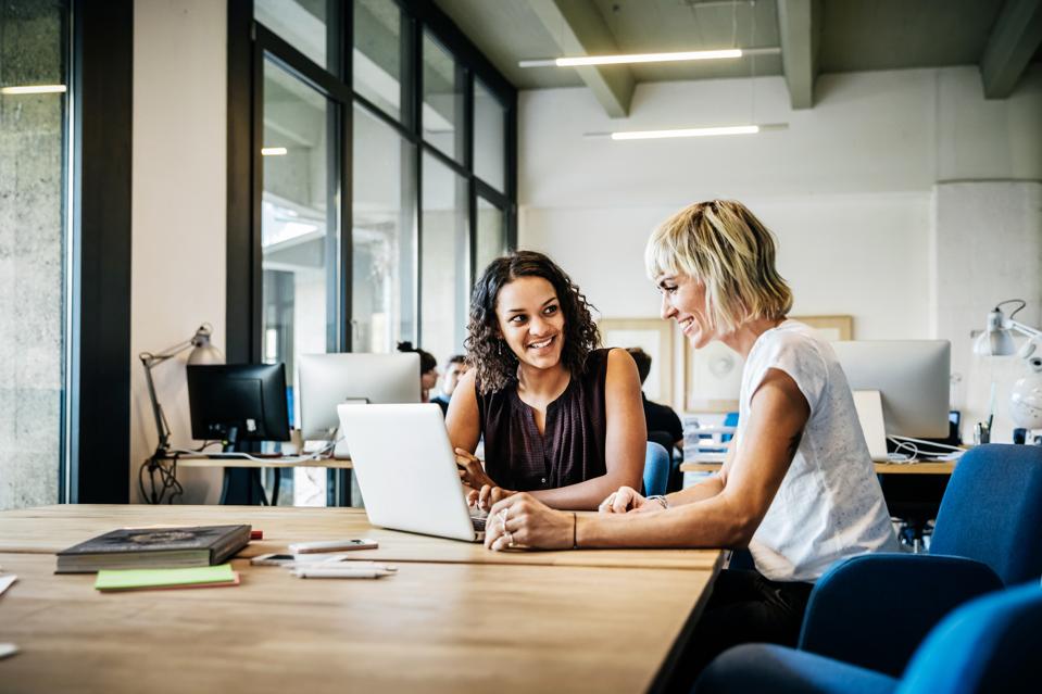 Casual start up businesswomen talking