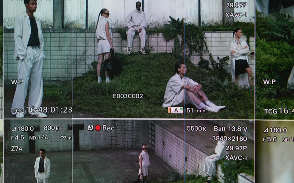 Models on set dressed in Rains SS21 collection.
