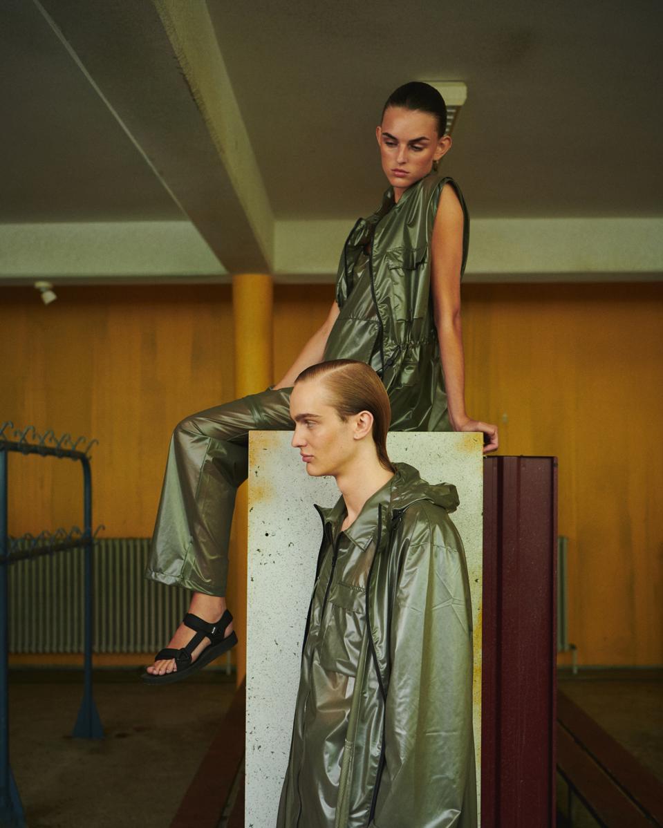 Models on set dressed in Rains SS21 collection.