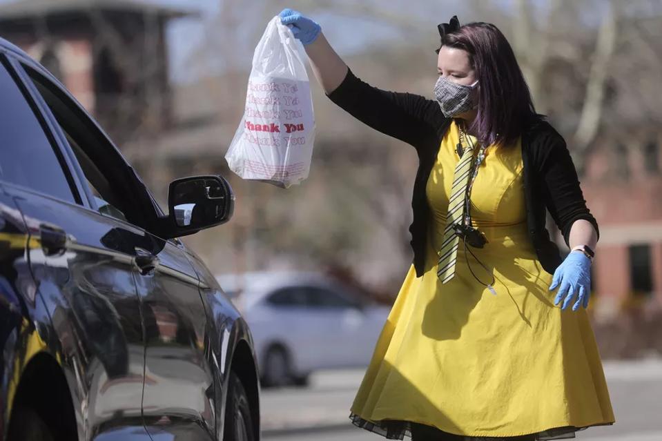 Springville, Utah librarians brightened customers days with not just curbside service, but also with themed costumes.
