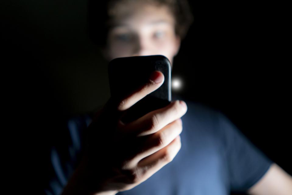 Phone user in dark