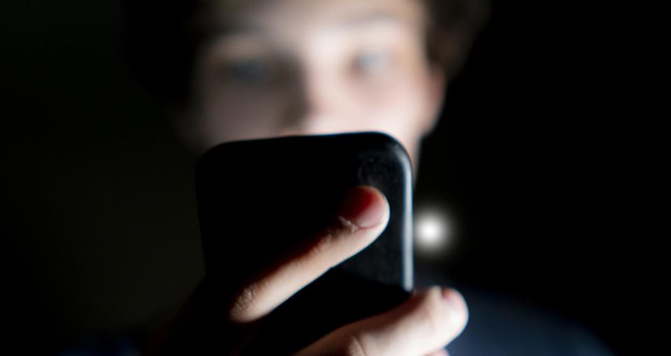 Phone user in dark