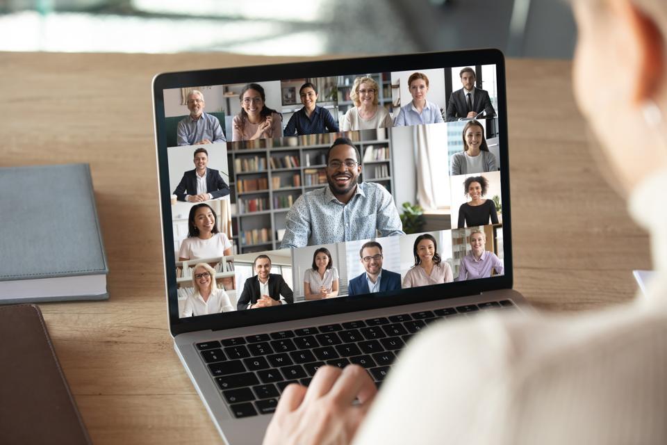 Female employee talk on video call with colleagues