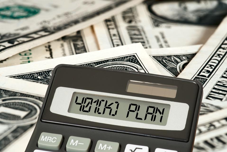 Dollar bills, calculator and 401 k Plan