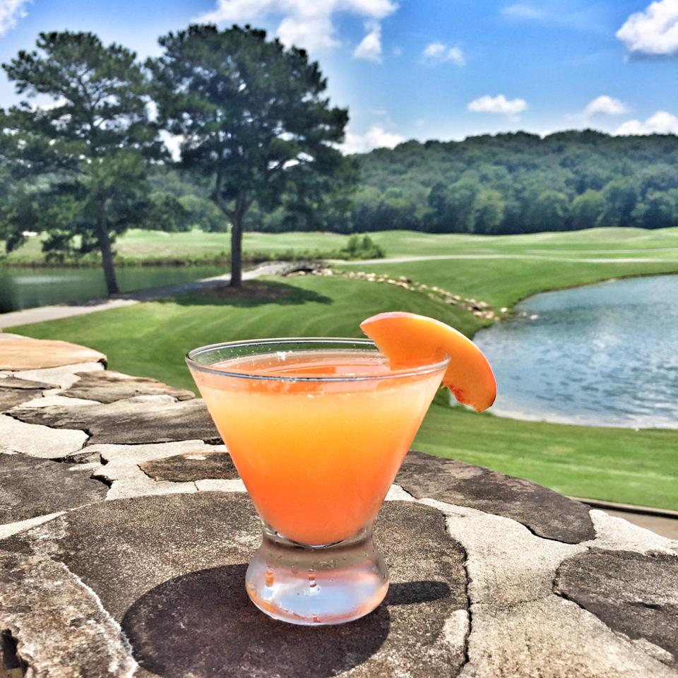 peach cocktail on golf course