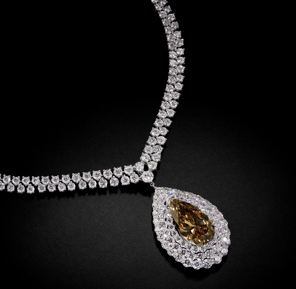 A diamond necklace by Graff, that features a 20.21-carat pear shaped yellow-brown diamond