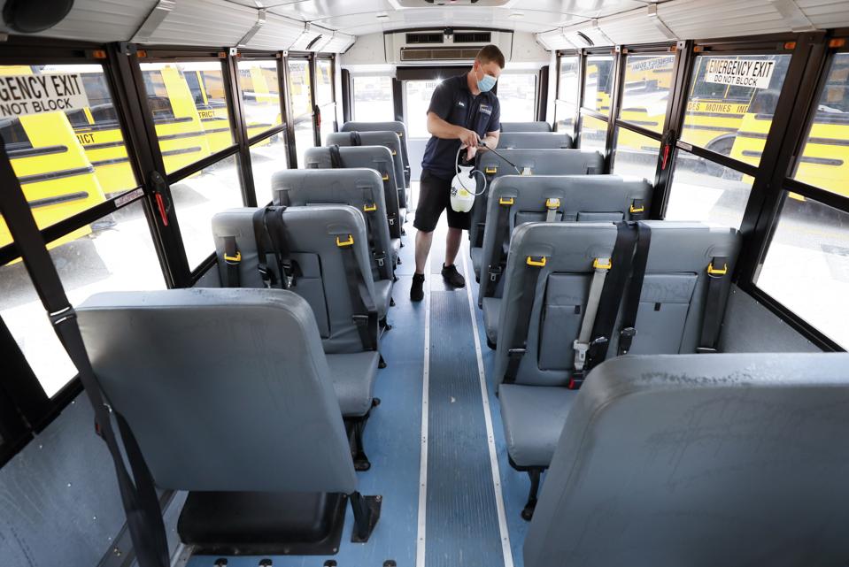 Virus Outbreak Iowa School Bus Cleaning
