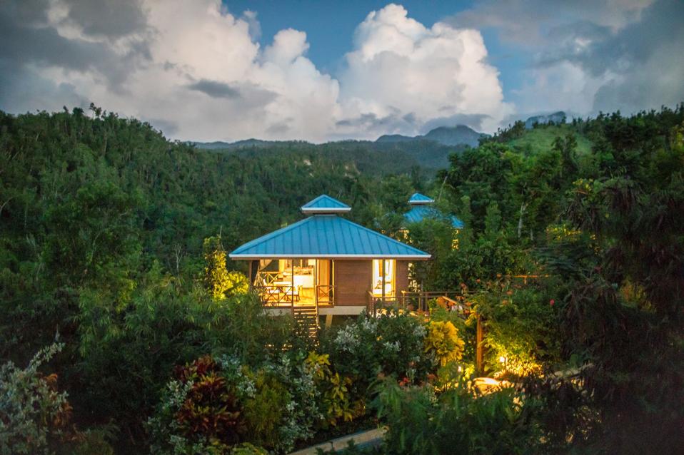 A hilltop villa in the midst of a lush rainforest