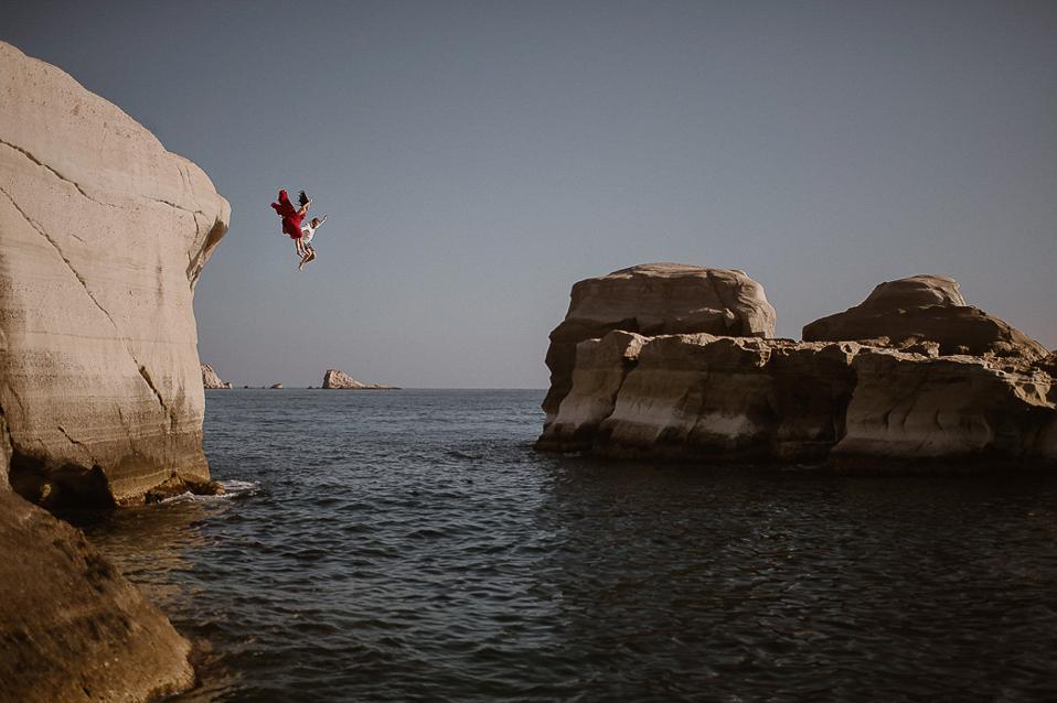 A newly wedded couple taking another leap in Greece.