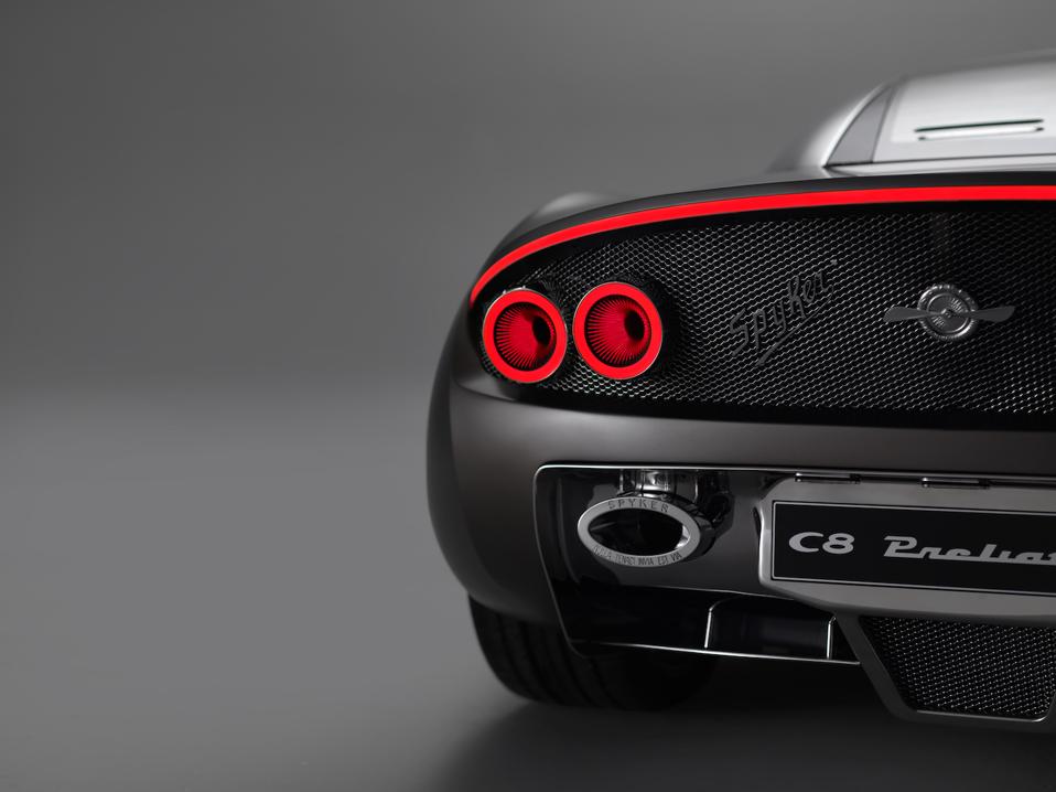 The rear quarter of a custom spyker supercar
