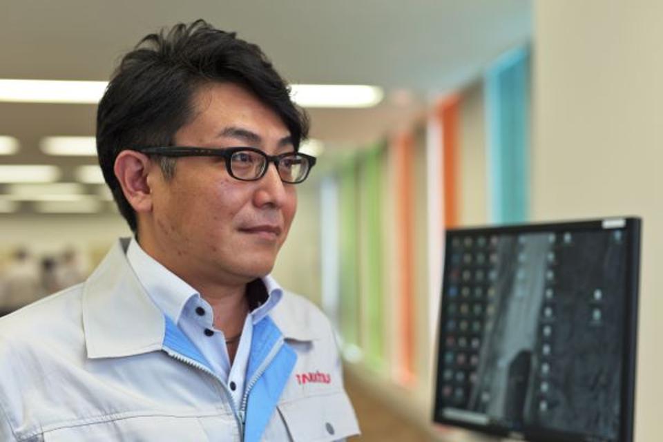 japanese companies guiding robots into