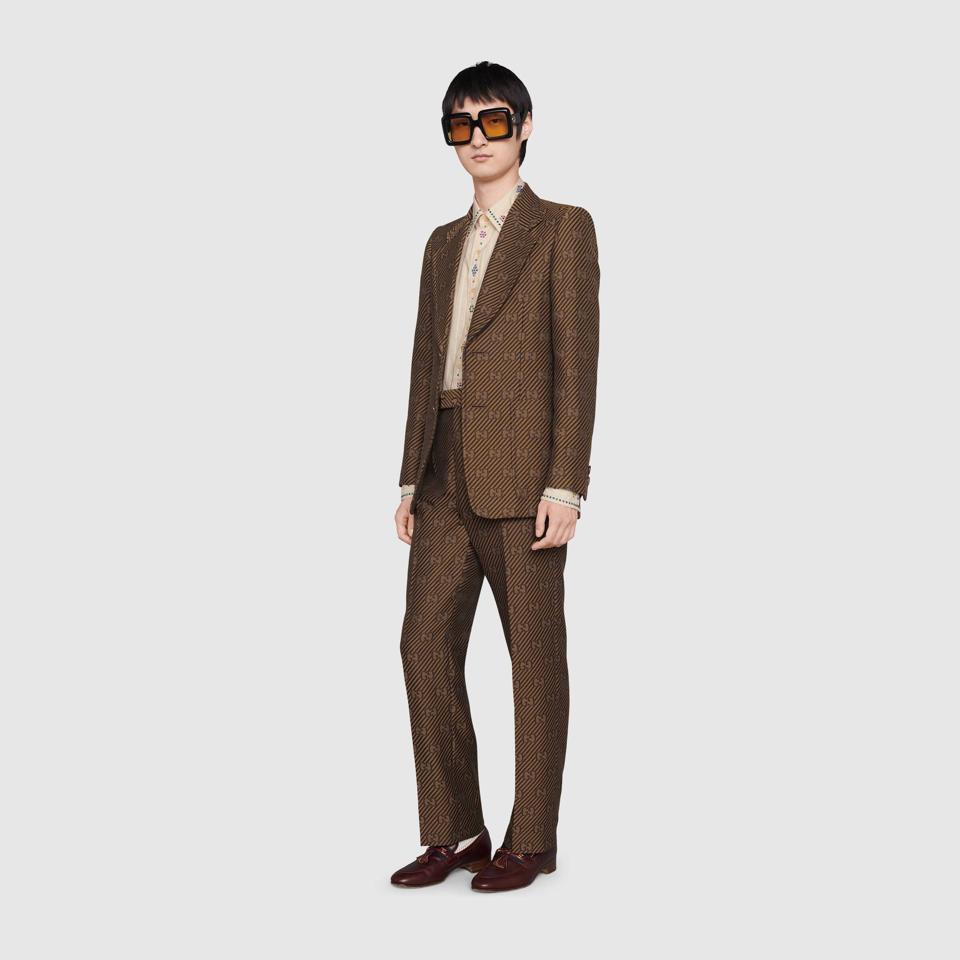 Gucci:Brown Suit: Diagonal GG stripe cotton silk jacket, GG stripe wool silk tailored pant, Gucci pinstripe cotton shirt with crystals