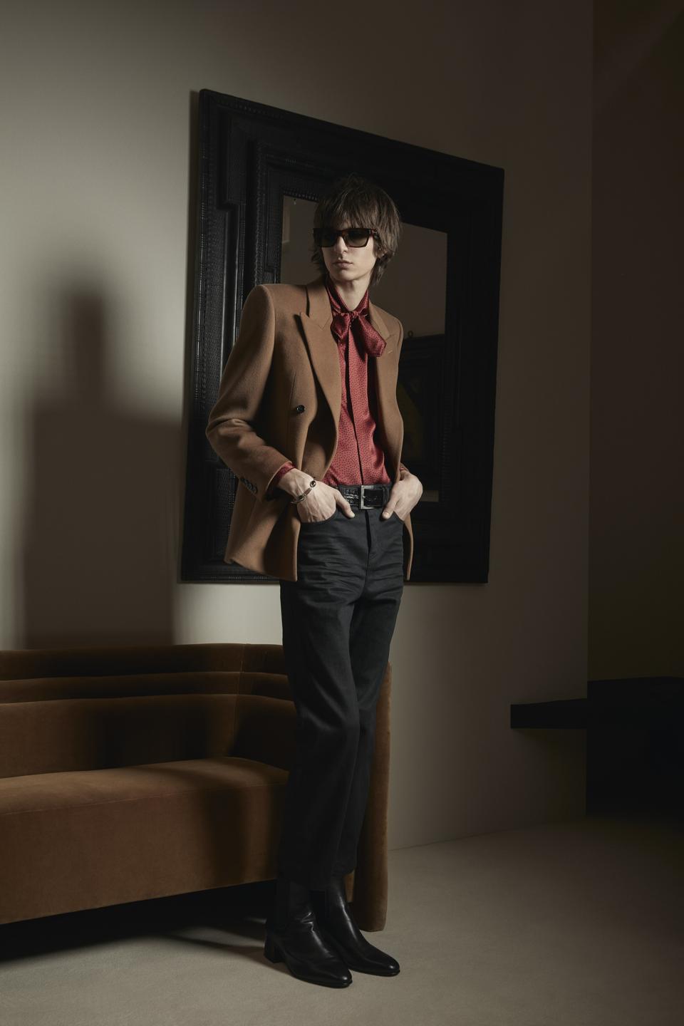 Courtesy of Saint Laurent Luxuriously crafted of a virgin wool and cashmere blend, this impeccably tailored jacket is finished with polished winged lapels.