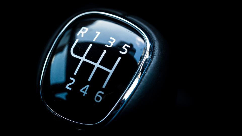 Close up of top of gear stick in car interior